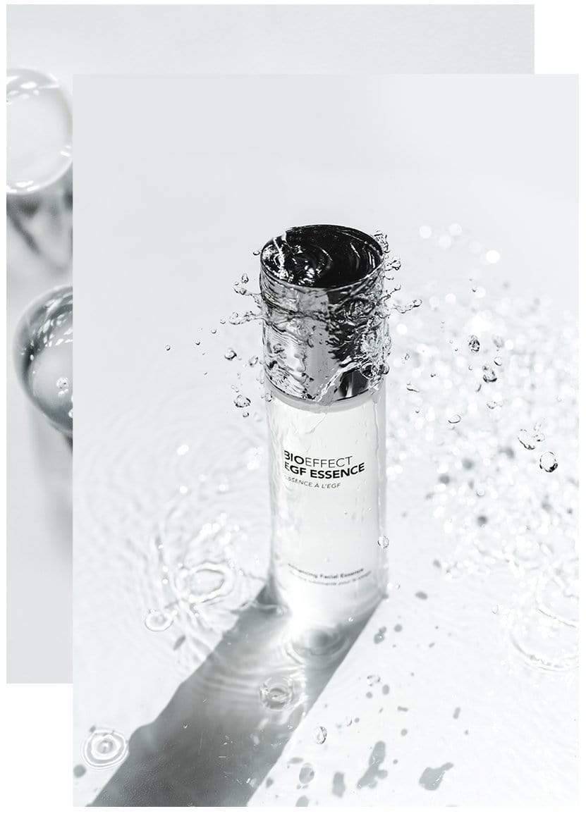 Bottle of BIOEFFECT EGF Skincare Hydrating Essence standing up underneath clear water.